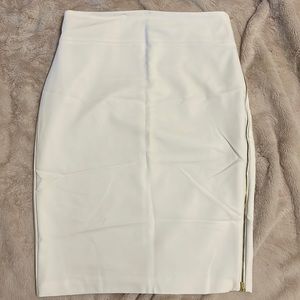 Express white pencil skirt, with gold zipper going down the side.